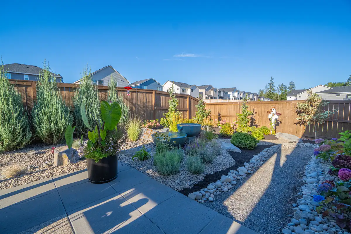 Layered planting beds and landscape renovation details by CreekView Landscape