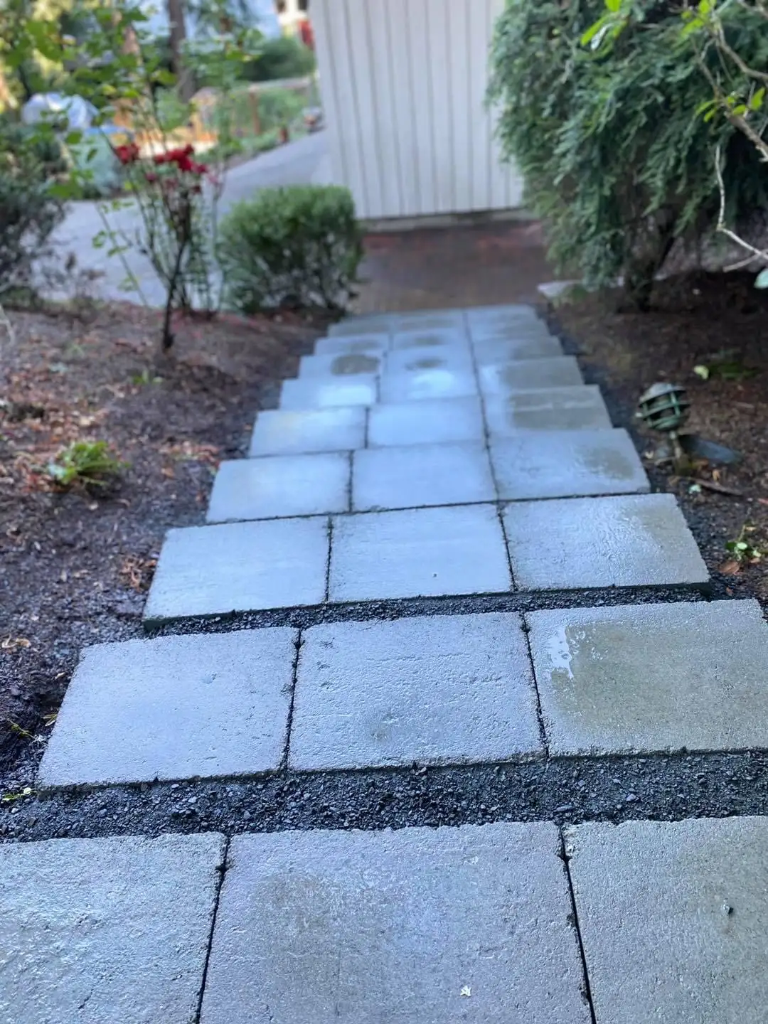 Paver patio with retaining wall by CreekView Landscape in Oregon